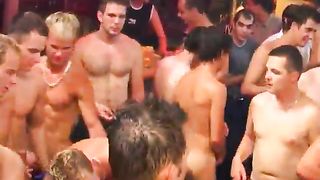 A large group of naked hunks strippers and beefcakes having an all out hard cocked orgy