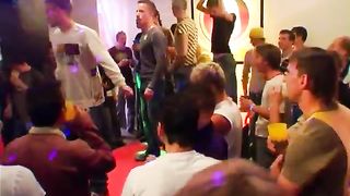 A group of males in a party turns into a bunch of guys stripping and showing off their peckers