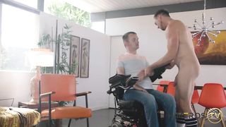 Guy in a wheelchair gets gagged and fucked by a hung muscled top 