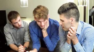 Three young businessmen have a breeding session in the office 