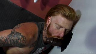 Tattooed Redhead Takes Raw BBC through Glory Hole Pride Studios - BussyHunter.com