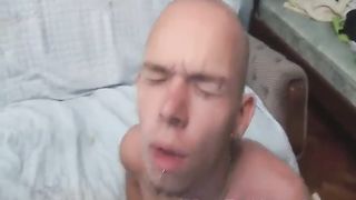 Bald stud gets his face covered in sperm after a rough anal