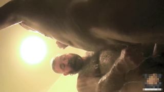 Two large gay bears have anal sex in the shower